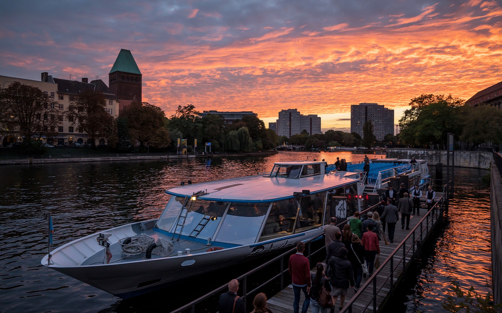 Berlin cityscape with boat cruising on the Spree River during 2.5-hour city boat tour.