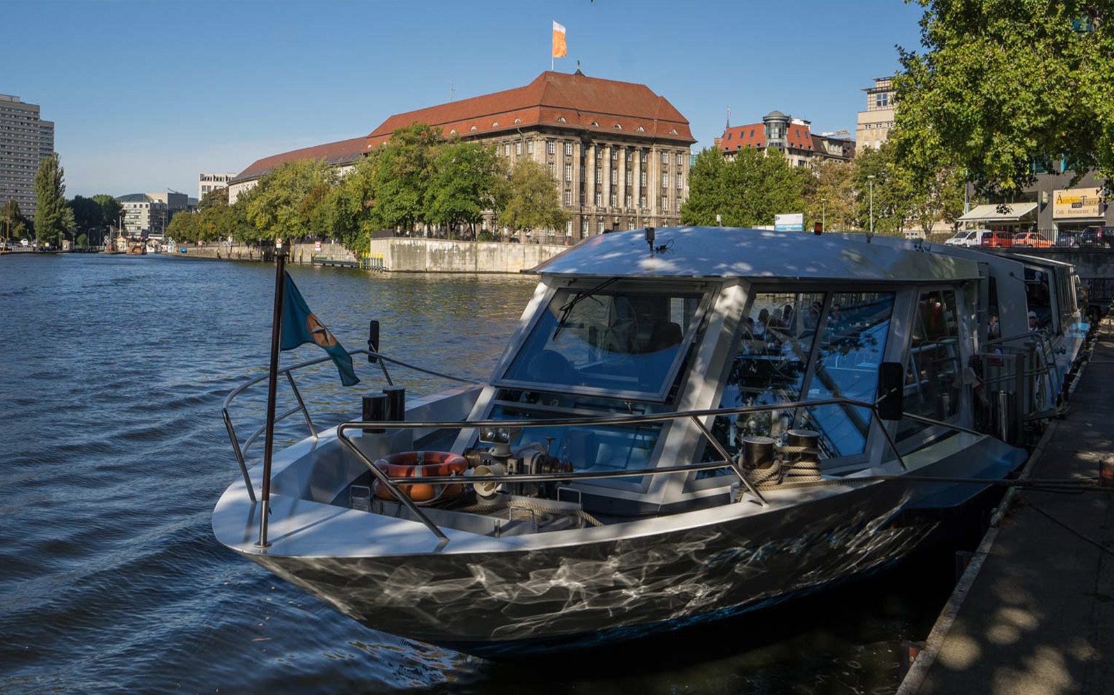 Berlin cityscape with boat cruising on the Spree River during 2.5-hour city boat tour to West Harbor.