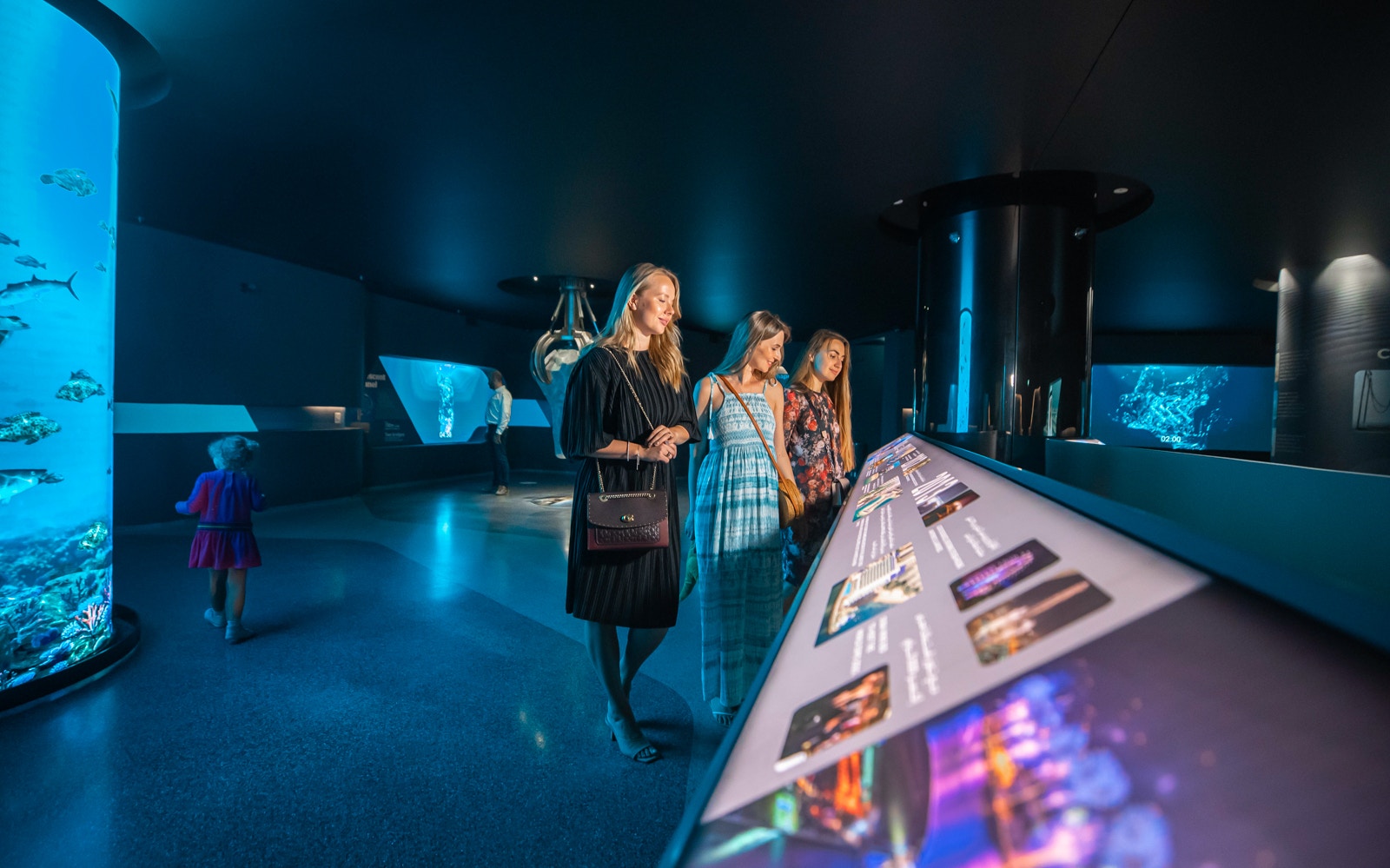 Visitors exploring interactive displays at The View at the Palm, Dubai.