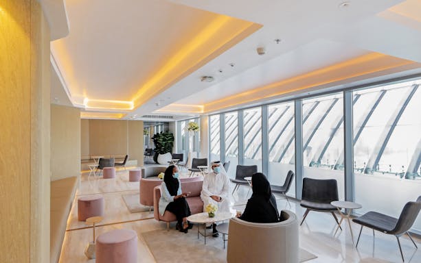 Visitors seated in a modern lounge at The View at the Palm, Dubai.