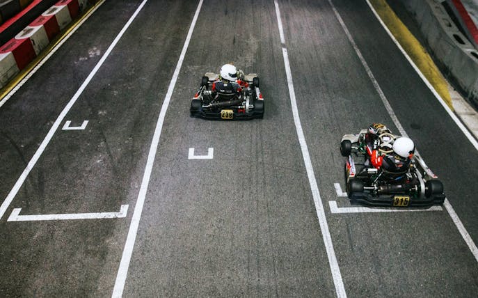 Go-karts racing on Kranji Fun Kart track in Singapore at 30kph or 50kph.