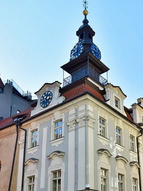 Prague Jewish Town Hall with clock tower under clear sky.