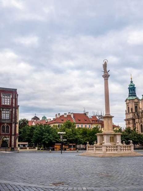 Prague Old Town Square with Astronomical Clock and St. Nicholas Church.