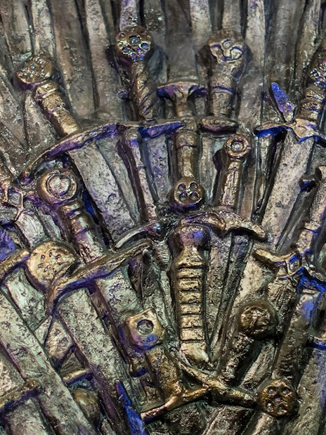 Iron Throne replica from Game of Thrones tour in Split, featuring swords and intricate details.