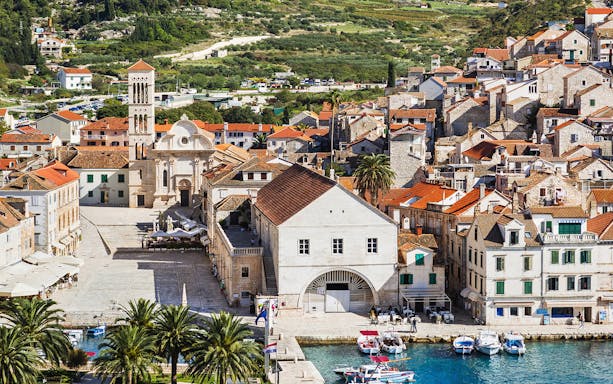 Historic waterfront view of Split, Croatia with boats and stone buildings.