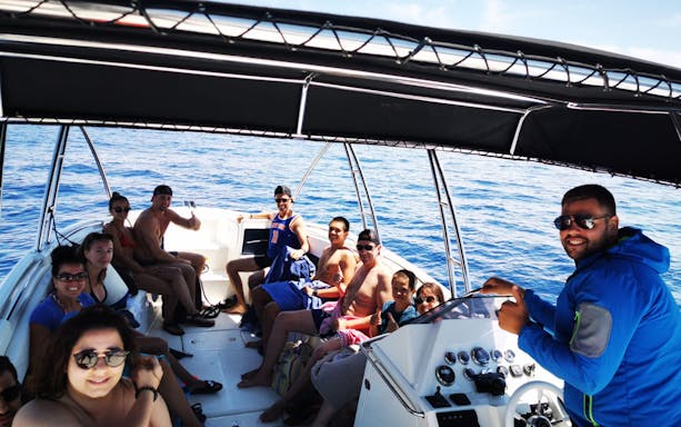 Group enjoying a boat ride on the Split Riviera during a sunset sightseeing cruise.
