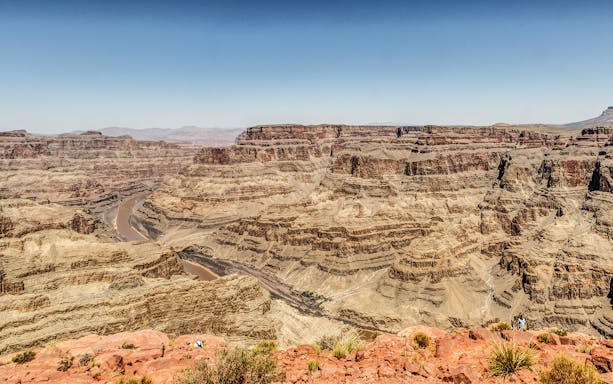 Grand Canyon West Rim view with Colorado River and rock formations.