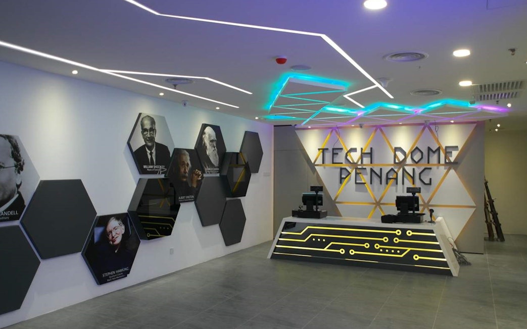 Tech Dome Penang entrance with geometric wall art and reception desk.