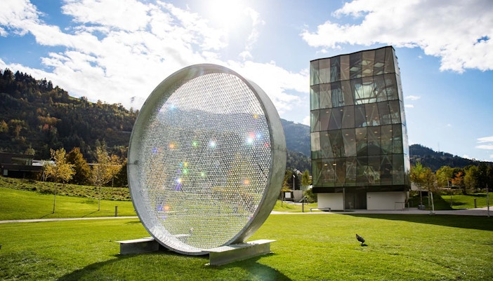 Swarovski Crystal Worlds entrance with visitors in Innsbruck, Austria.