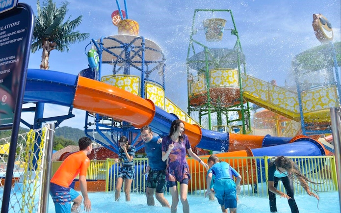 Visitors enjoying water slides at Langkawi Wildlife Park's Splash Out attraction.