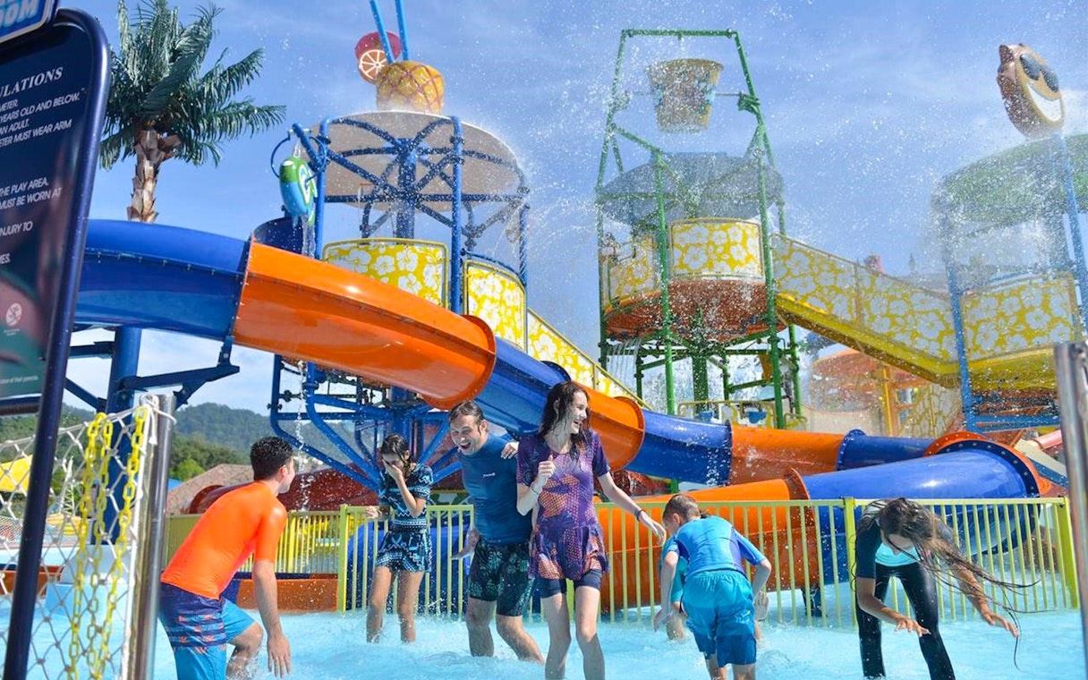 Visitors enjoying water slides at Langkawi Wildlife Park's Splash Out attraction.
