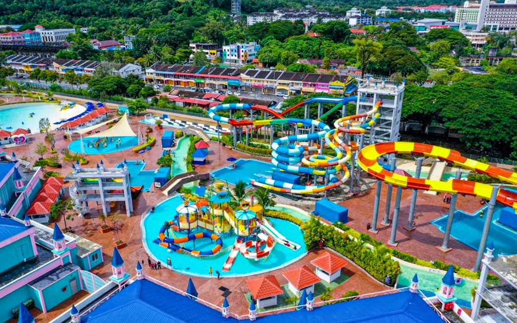 Water park with colorful slides and pools in Langkawi, Malaysia, part of Splash Out tour.
