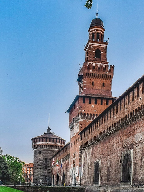 Sforza Castle exterior with tower and brick walls, Milan, Italy.