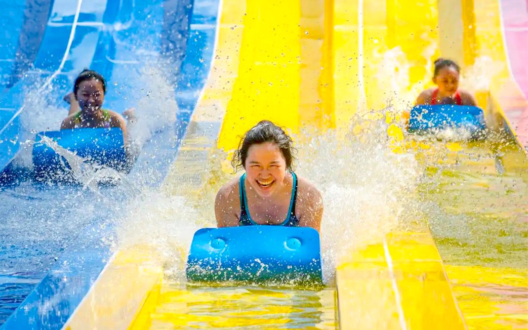 Visitors enjoying water slides at ESCAPE Penang.