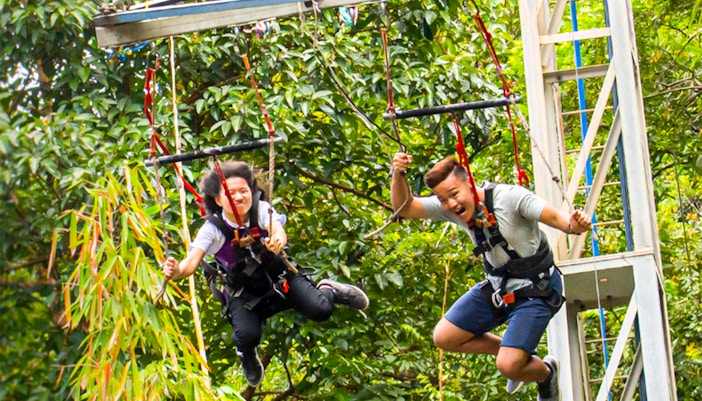 Visitors exploring the vibrant and colorful and the thrilling ESCAPE Penang adventure park in Penang, Malaysia