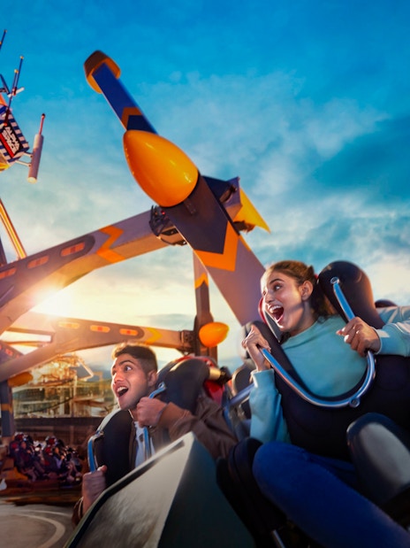 Visitors enjoying a thrilling ride at Skytropolis Theme Park.