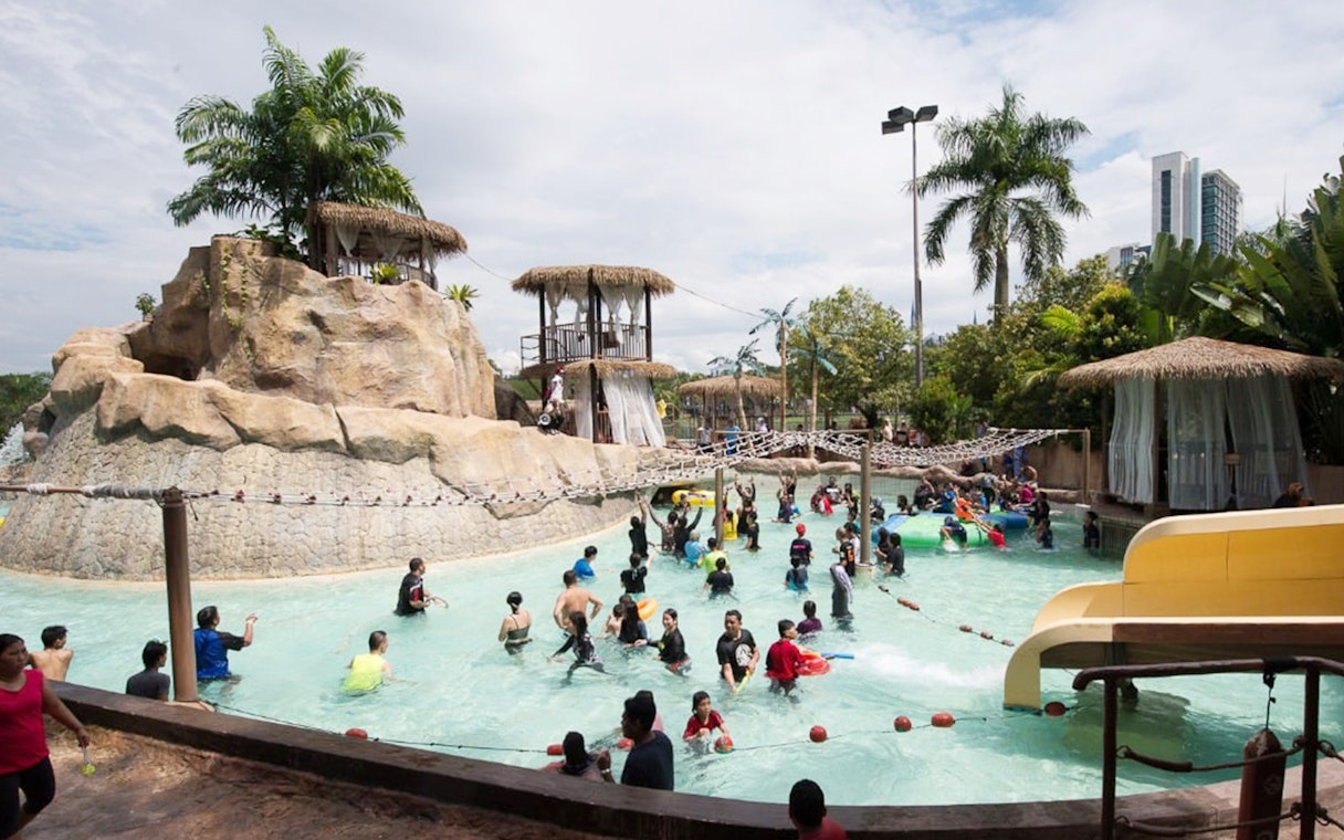 Visitors enjoying the pool and slides at Wet World Water Park, Shah Alam.
