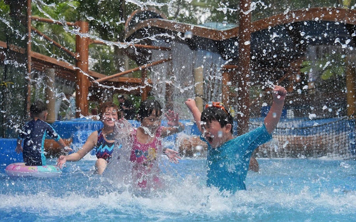 Children playing in a splash zone at Wet World Water Park Shah Alam.