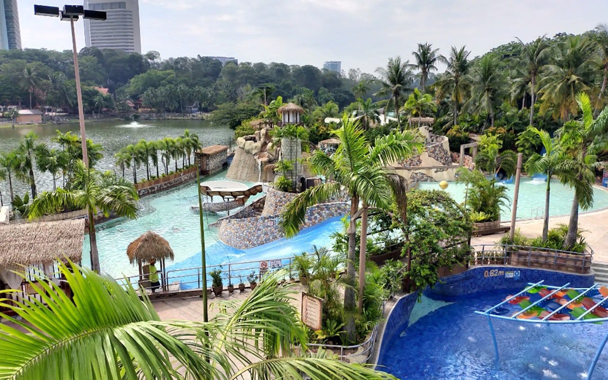 Wet World Water Park Shah Alam with pools, slides, and tropical landscaping.