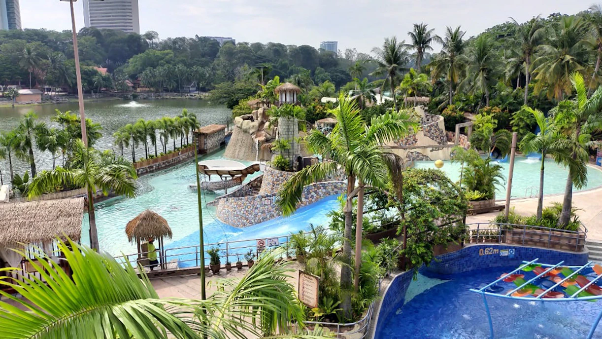 Wet World Water Park Shah Alam with pools, slides, and tropical landscaping.
