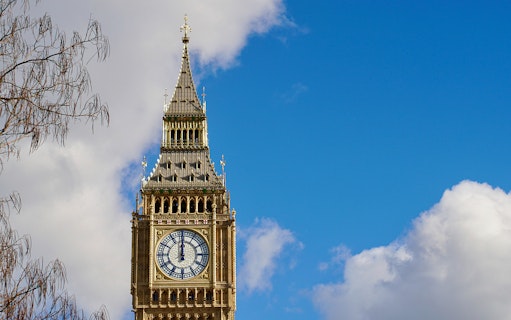 Clock tower of Big Ben against blue sky, London walking tour.