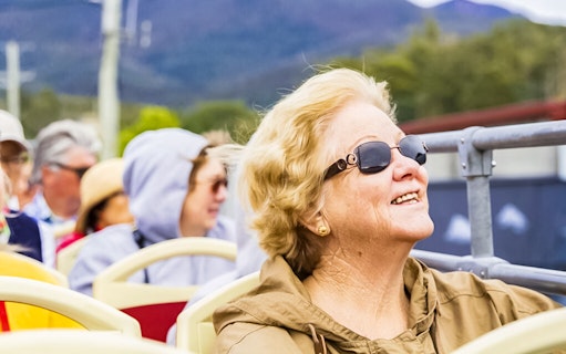 Passengers enjoying the Red Decker Hobart Hop-On Hop-Off Bus Tour.