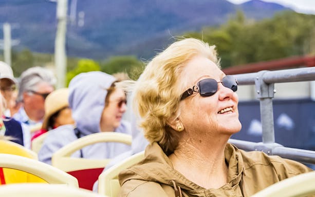Passengers enjoying the Red Decker Hobart Hop-On Hop-Off Bus Tour.