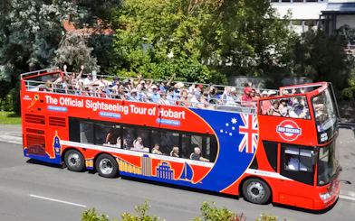 Hobart sightseeing bus with passengers on an open-top deck.