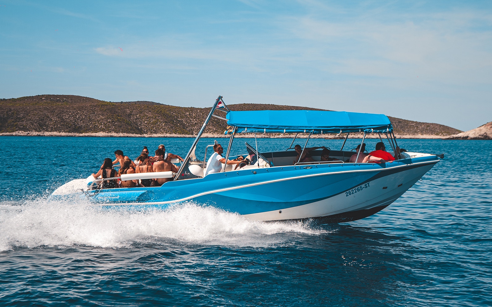 Speedboat with tourists on Blue Cave Tour from Split, Croatia.