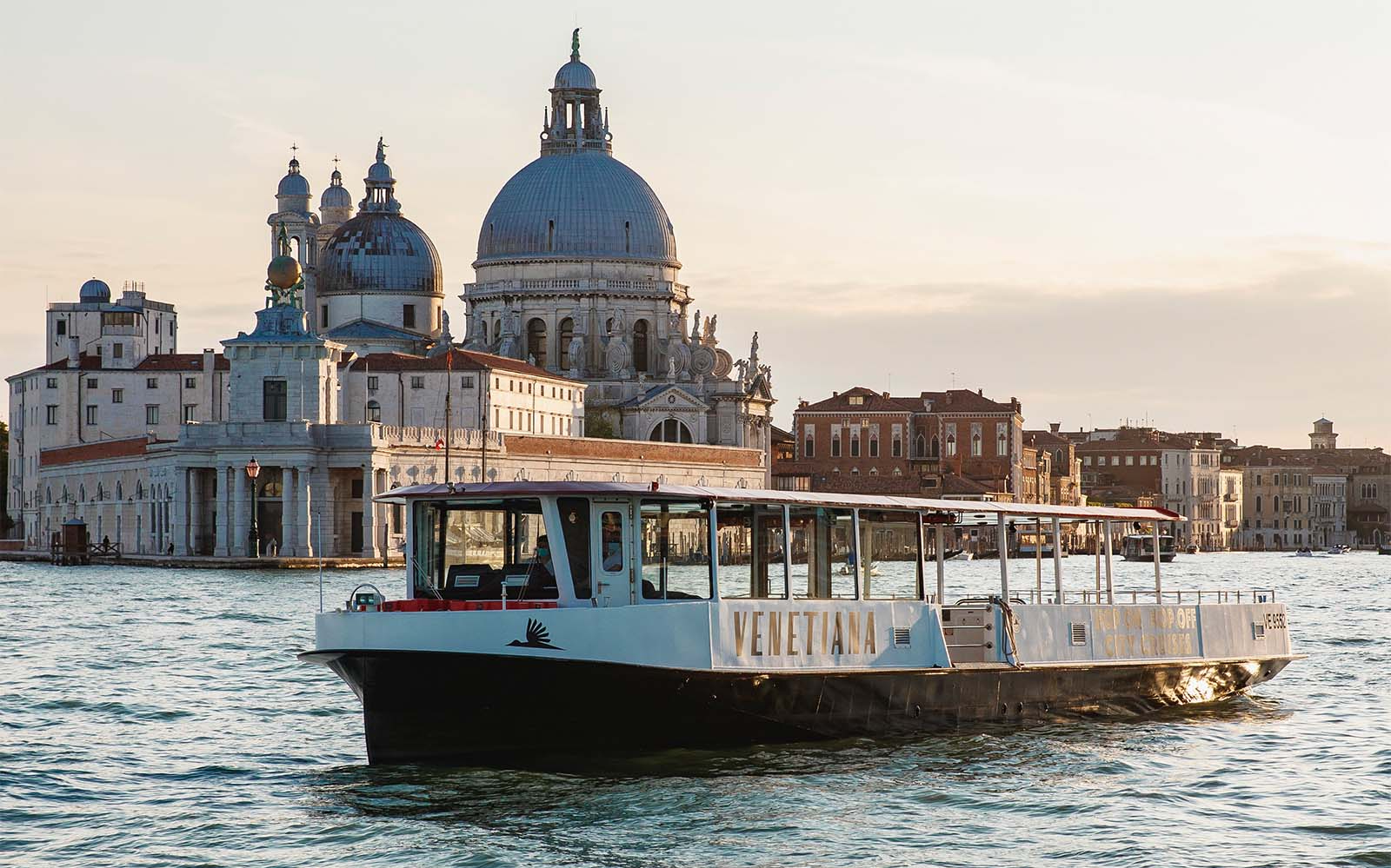 Hop-on hop-off boat near Santa Maria della Salute, Venice.