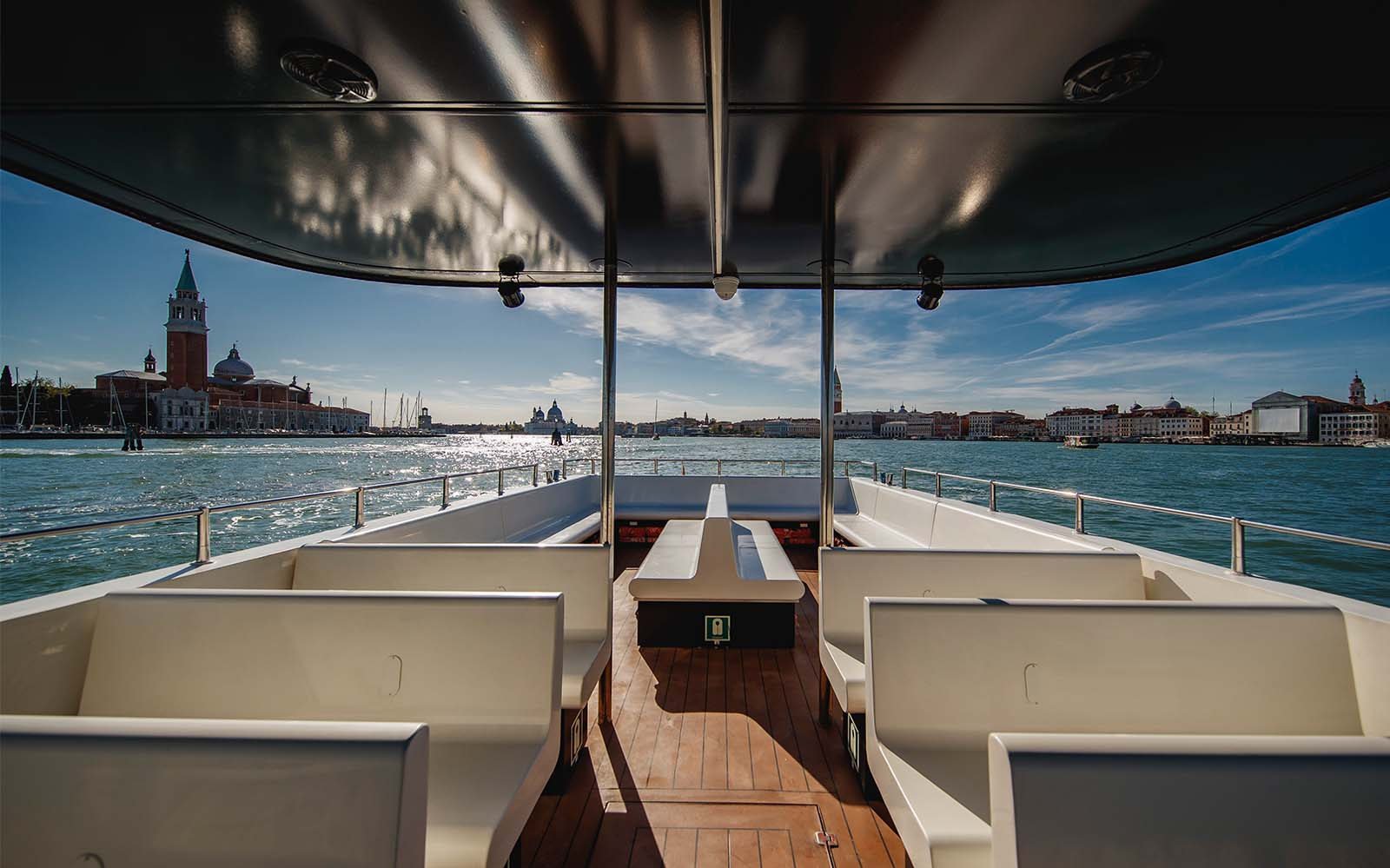 Hop-on hop-off boat with view of Venice's San Giorgio Maggiore Island.