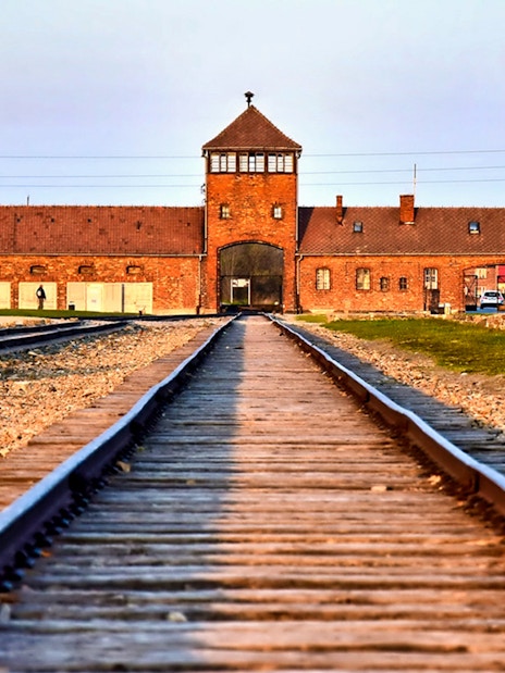 Rail tracks leading to Auschwitz-Birkenau entrance, part of guided tour from Krakow.
