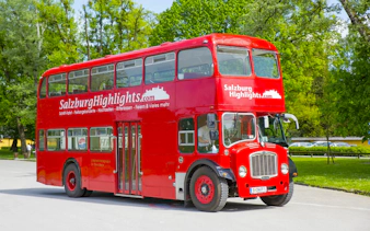 Red double-decker bus for Salzburg River Cruise and Hellbrunn Palace tour.