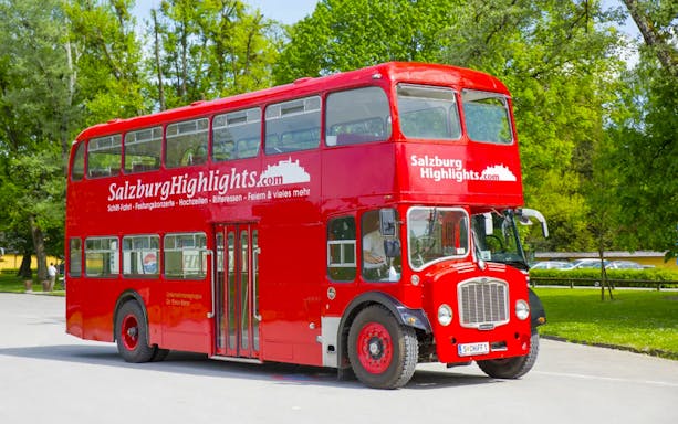 Red double-decker bus for Salzburg River Cruise and Hellbrunn Palace tour.