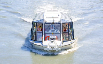 Salzburg river cruise boat with passengers on a scenic tour.