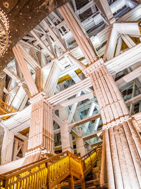 Wieliczka Salt Mine's wooden structures and chandelier, part of full-day tour.
