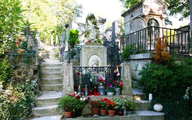 Tomb of Frédéric Chopin with flowers at Père Lachaise Cemetery, Paris.