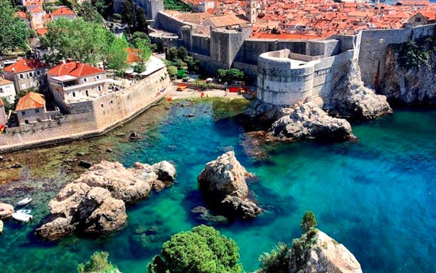 Aerial view of Dubrovnik's Old Town walls and coastline, Croatia.