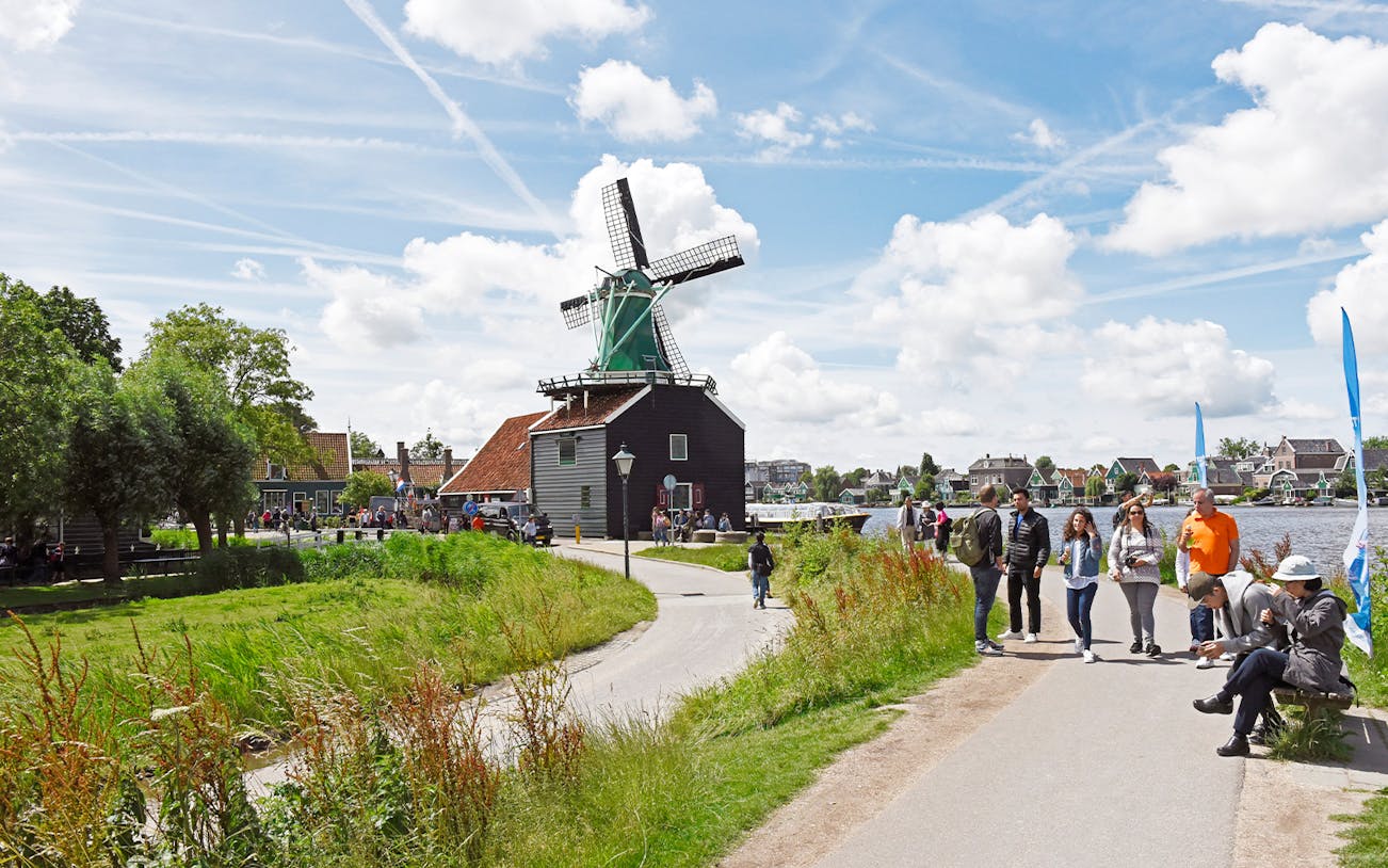 Windmill and visitors at Zaanse Schans during Floriade Expo Half Day Tour from Amsterdam.