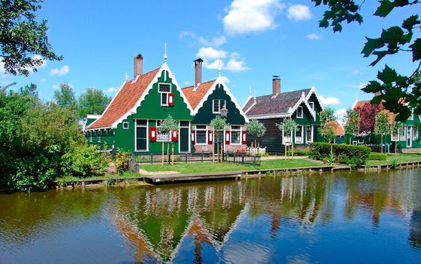 Traditional Dutch houses by a canal on the Floriade Expo Half Day Tour from Amsterdam.