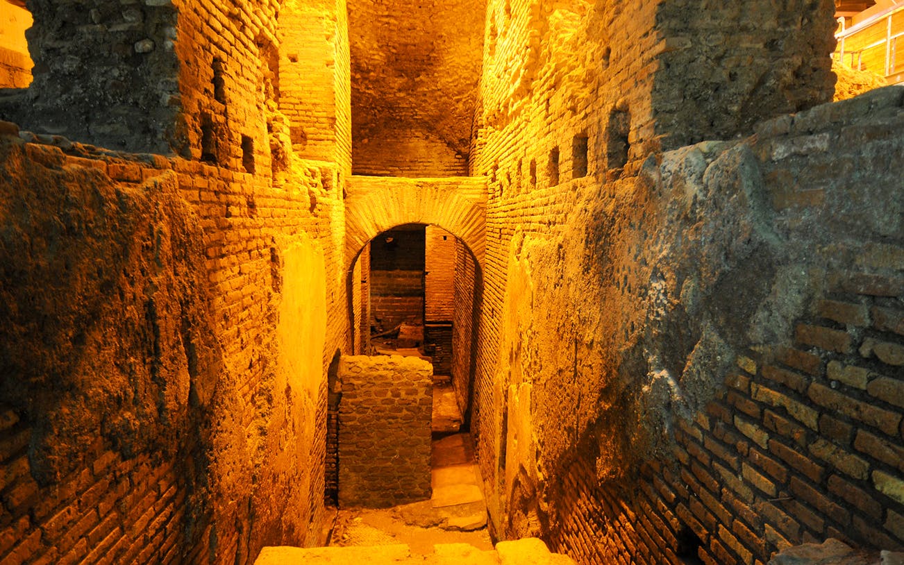 Trevi District underground aqueduct and ancient brick walls in Rome.