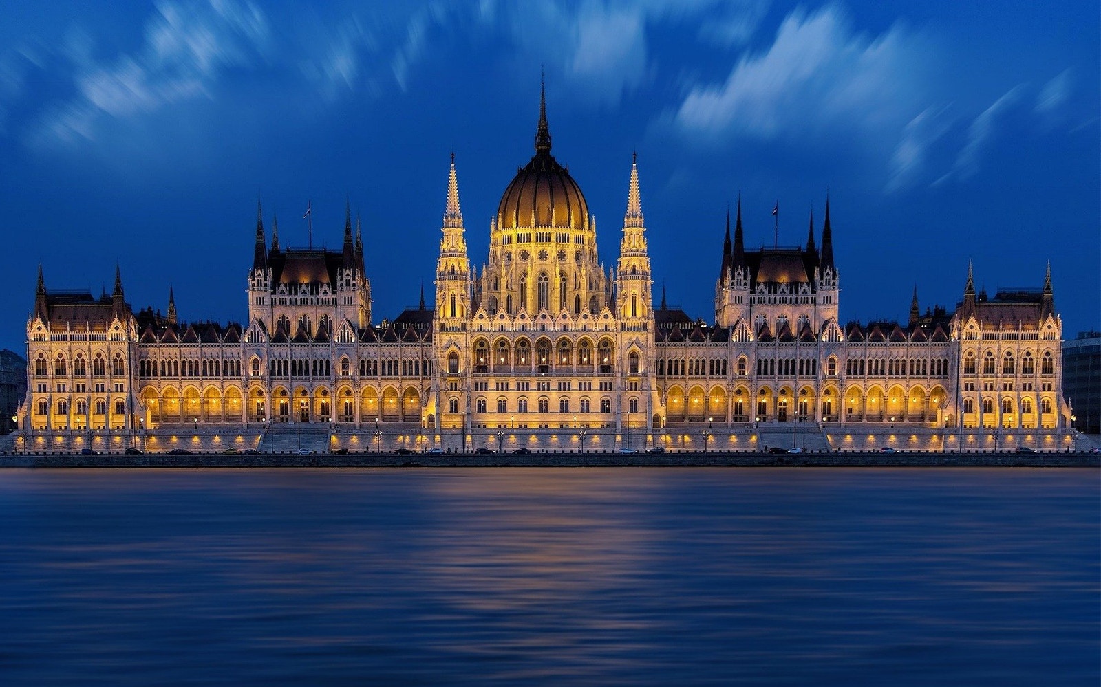 Hungarian Parliament building exterior with guided tour group in Budapest.
