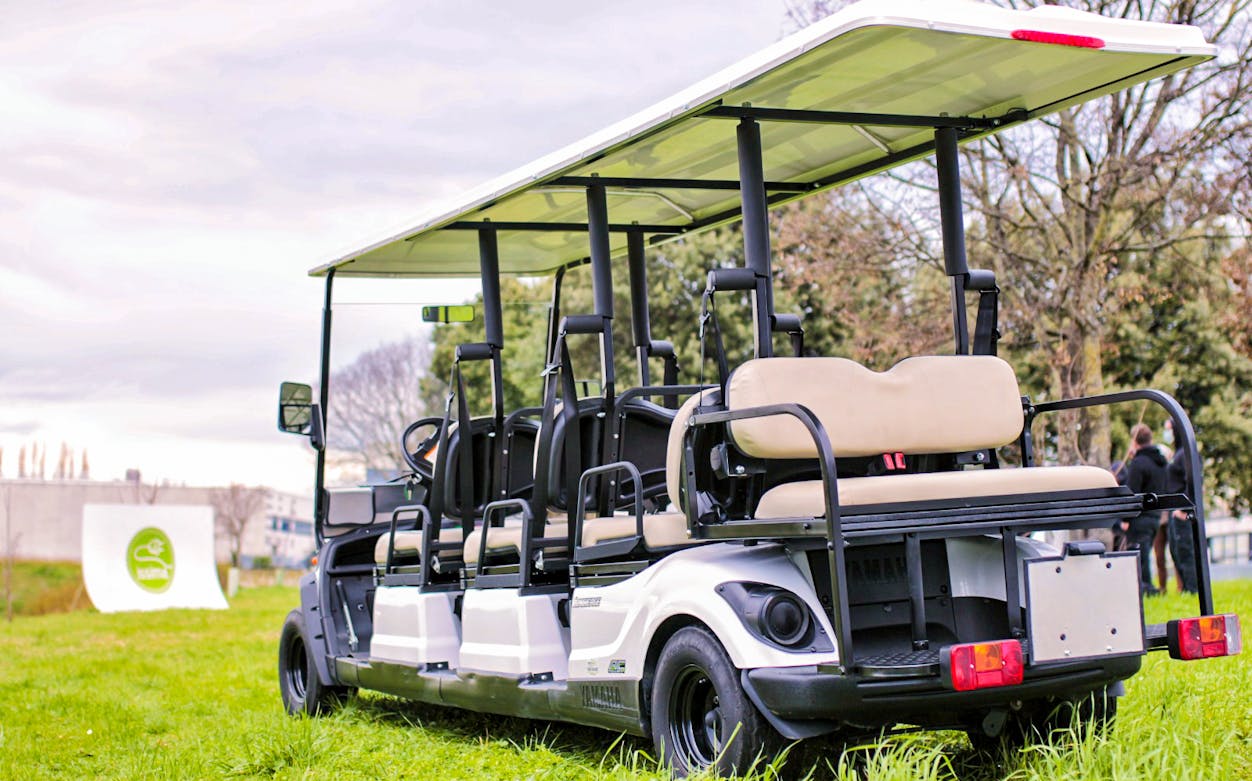 Electric golf cart parked on grass for Florence Grand Tour.