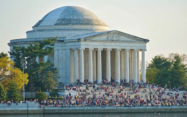Crowd at the Jefferson Memorial in Washington, DC during a guided bus tour.