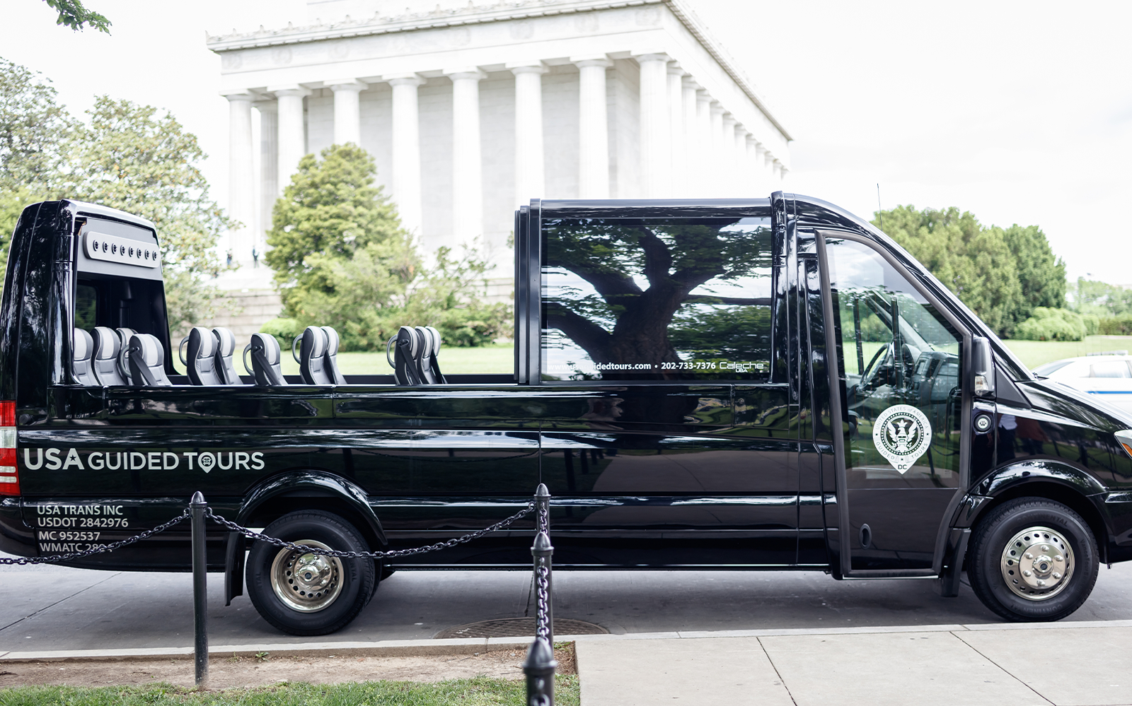 Open-top tour bus in front of the Lincoln Memorial, Washington, DC.