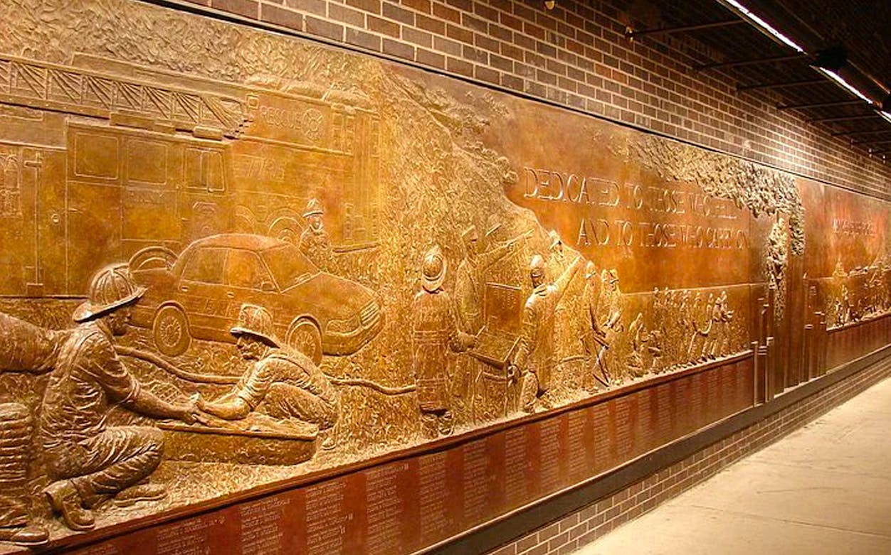 Firefighter memorial wall at Ground Zero 911 Memorial, New York City.