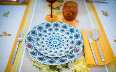 Colorful plates set on a table for a private cooking class in Bologna.