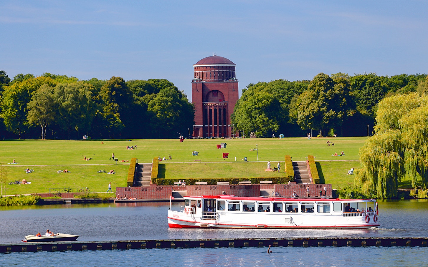 Gondola on Venice canal with historic buildings in the background.