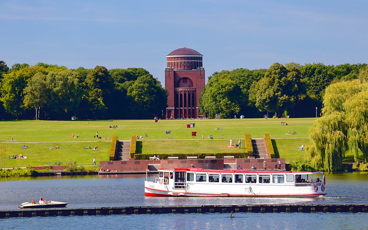 Boat on Alster Lake with Hamburg Planetarium in background, part of Combo: Panoptikum + Alster Round Trip.