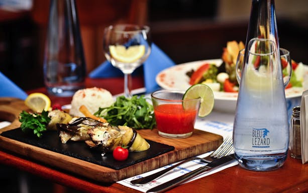 Swiss cuisine platter with vegetables and sauce at a Lausanne restaurant, part of Taste my Swiss City tour.